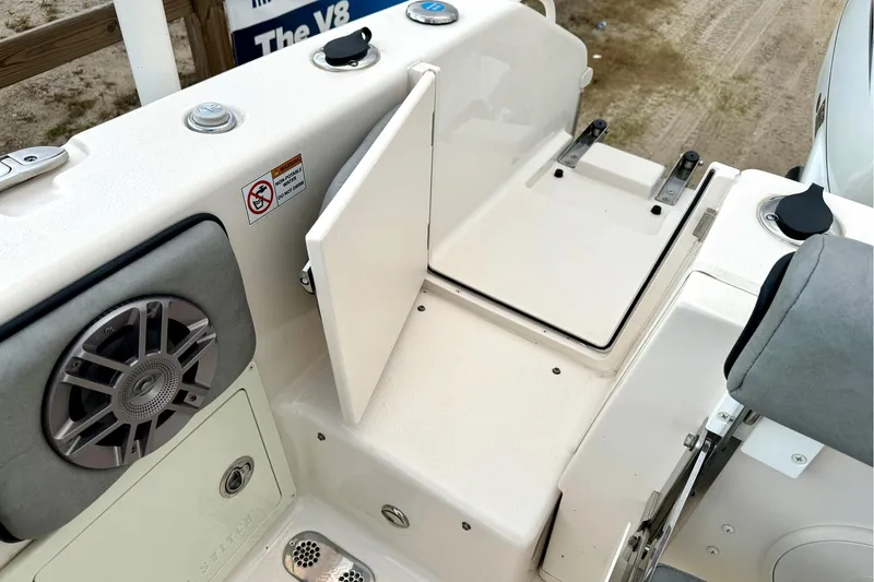 Slide: The Image of 2023 Sea Chaser 30 HFC CC boat interior with speaker and storage compartment. - 32