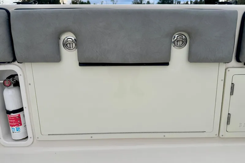 Slide: The Image of 2023 Sea Chaser 30 HFC CC boat interior with storage compartment and fire extinguisher. - 35