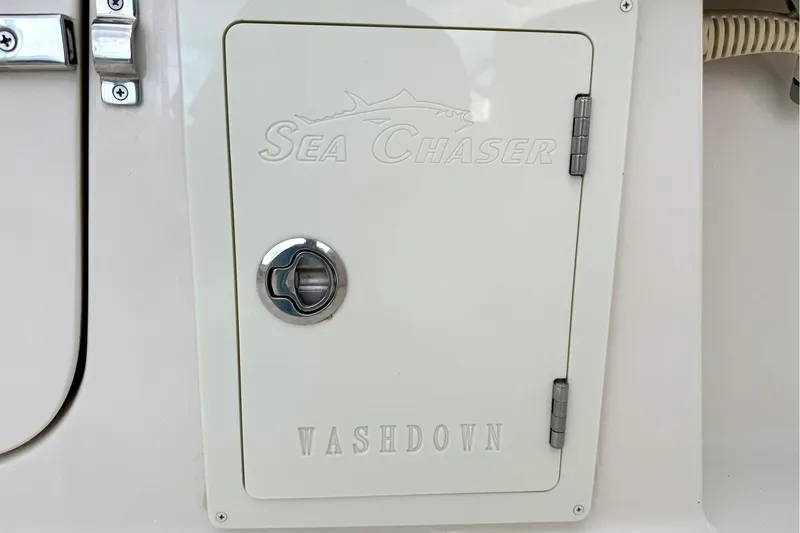 Slide: The Image of 2023 Sea Chaser 30 HFC CC washdown compartment with secure latch and hinges. - 37