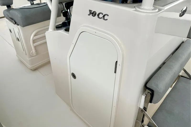 Slide: The Image of 2023 Sea Chaser 30 HFC CC boat interior with seating and storage compartment. - 38