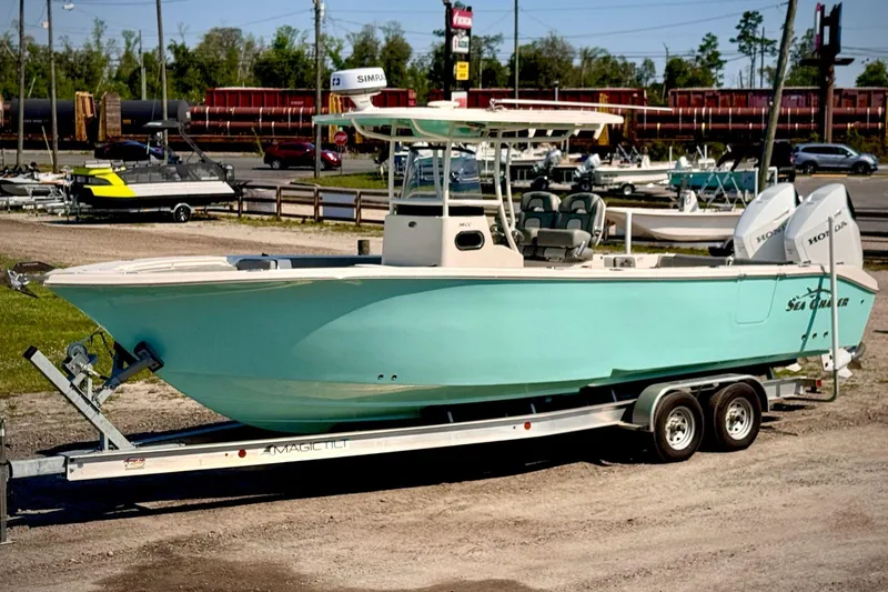 Slide: The Image of 2023 Sea Chaser 30 HFC CC boat on trailer, parked outdoors. - 4