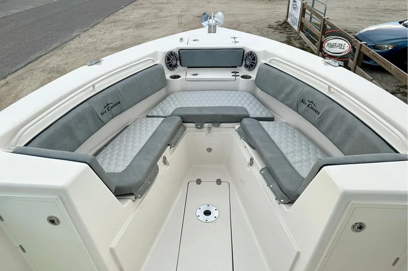 Slide: The Image of 2023 Sea Chaser 30 HFC CC boat interior with cushioned seating and storage compartments. - 45