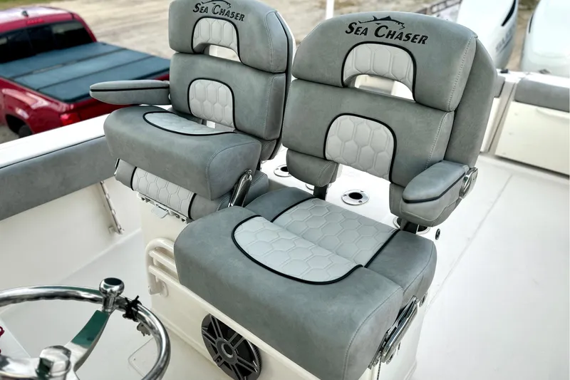 Slide: The Image of 2023 Sea Chaser 30 HFC CC boat seats, gray upholstery, hexagonal pattern, armrests. - 47