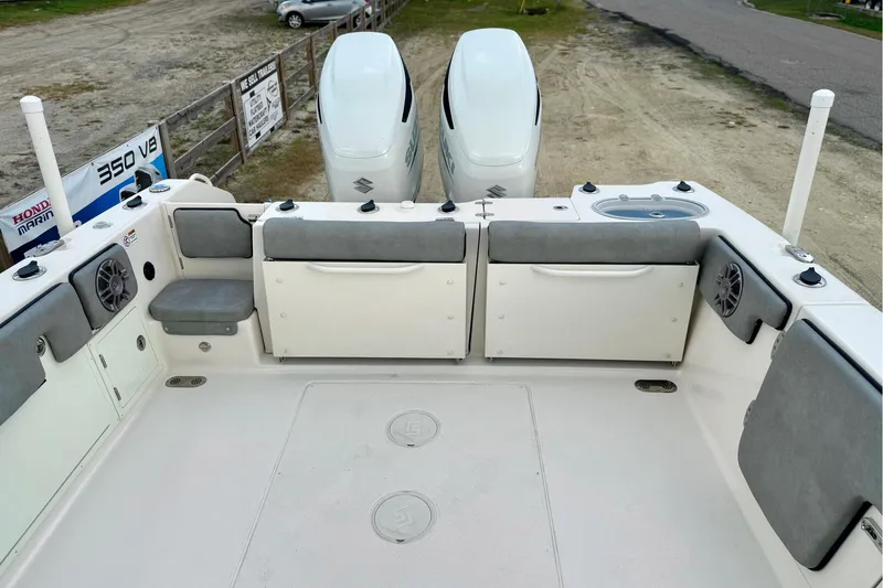 Slide: The Image of 2023 Sea Chaser 30 HFC CC boat interior with dual engines and seating area. - 48