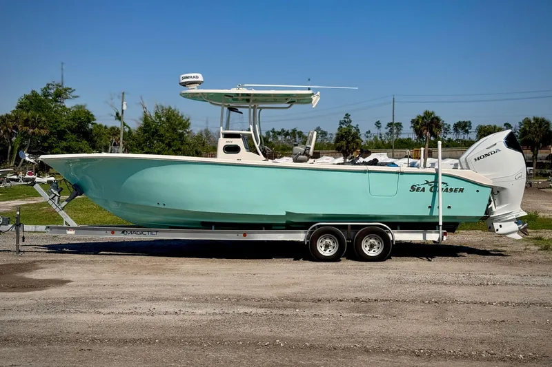 Slide: The Image of 2023 Sea Chaser 30 HFC CC boat on trailer, side view, outdoors. - 5