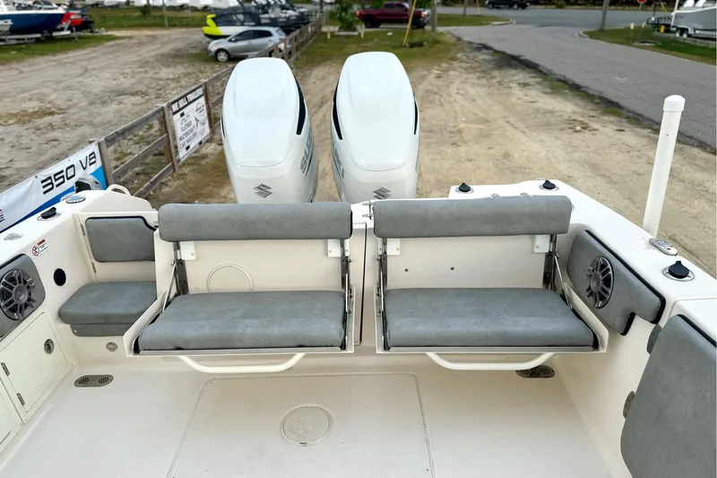 Slide: The Image of 2023 Sea Chaser 30 HFC CC boat with dual engines and cushioned seating. - 50