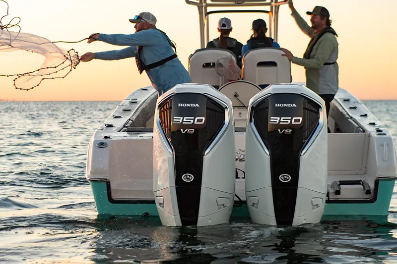 Slide: The Image of 2023 Sea Chaser 30 HFC CC boat with dual Honda 350 V8 engines at sunset. - 54