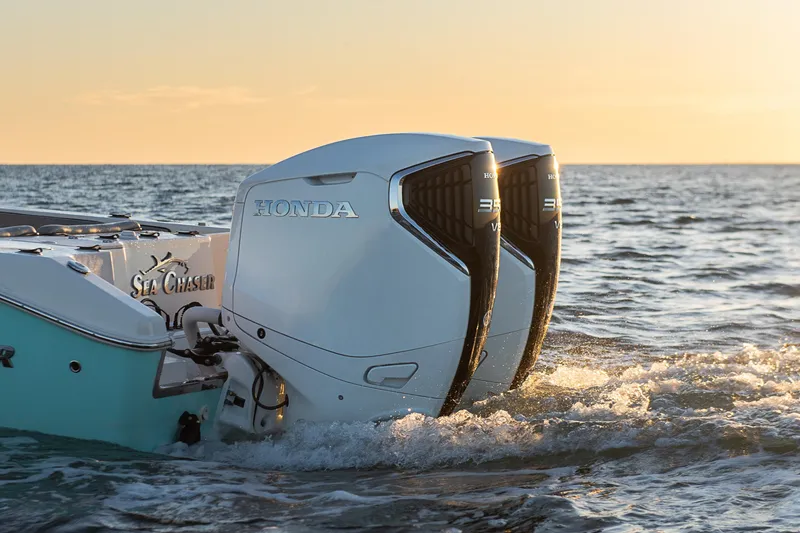 Slide: The Image of 2023 Sea Chaser 30 HFC CC with dual Honda outboard engines at sunset. - 55