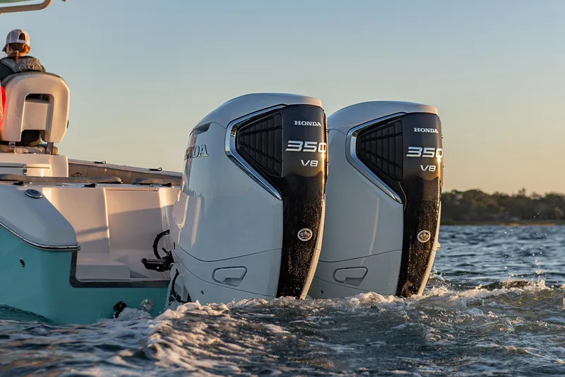 Slide: The Image of 2023 Sea Chaser 30 HFC CC with dual Honda 350 V8 engines on water. - 56