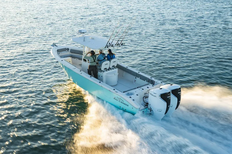Slide: The Image of 2023 Sea Chaser 30 HFC CC boat cruising on open water with dual engines. - 57