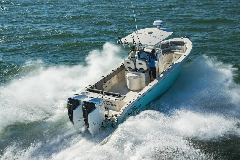 Slide: The Image of 2023 Sea Chaser 30 HFC CC boat cruising on open water with passengers. - 58
