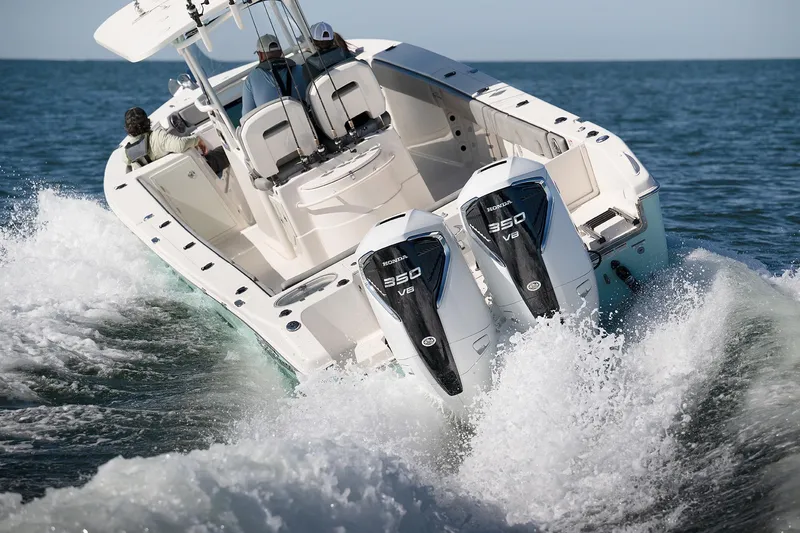 Slide: The Image of 2023 Sea Chaser 30 HFC CC boat cruising with dual Honda 350 V8 engines. - 60