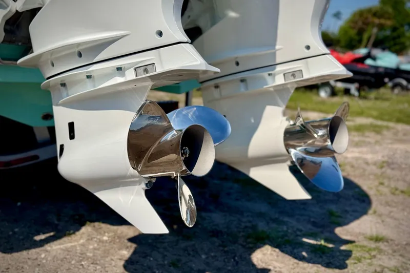 Slide: The Image of Twin propellers of a 2023 Sea Chaser 30 HFC CC boat, shining in sunlight. - 9