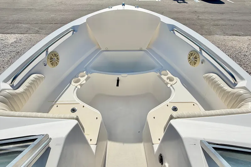 Slide: The Image of 2009 Mako 216 Dual Console boat interior with seating and cup holders. - 30