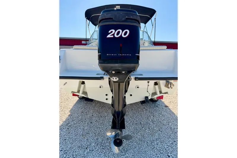 Slide: The Image of 2009 Mako 216 Dual Console boat with 200 horsepower outboard motor. - 33