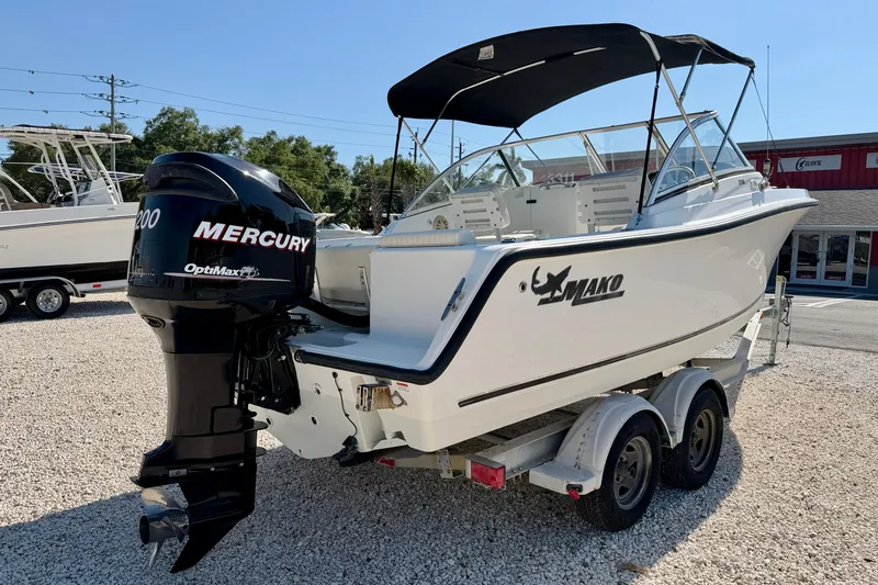 Slide: The Image of 2009 Mako 216 Dual Console boat with Mercury OptiMax engine on trailer. - 5