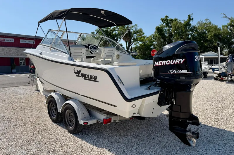 Slide: The Image of 2009 Mako 216 Dual Console boat with Mercury OptiMax engine on trailer. - 7