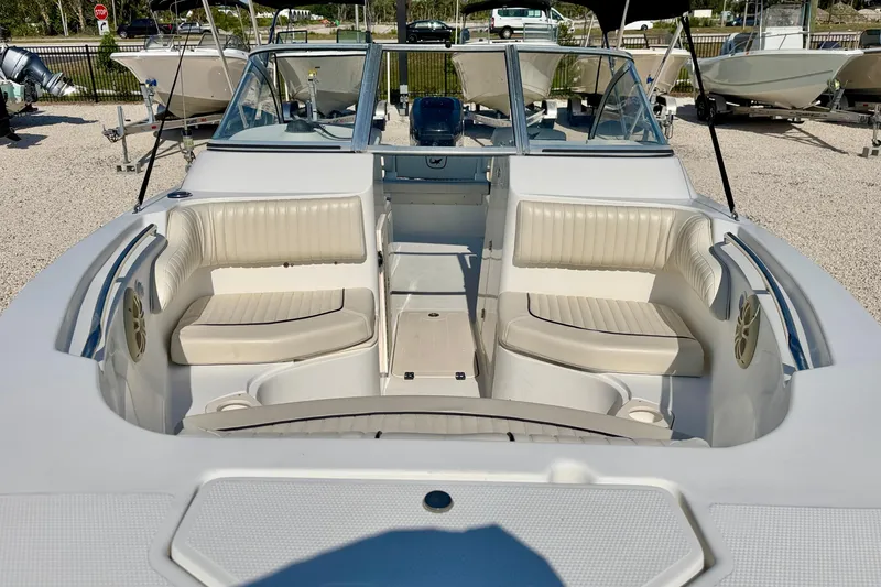 Slide: The Image of 2009 Mako 216 Dual Console boat with spacious seating and modern design. - 8