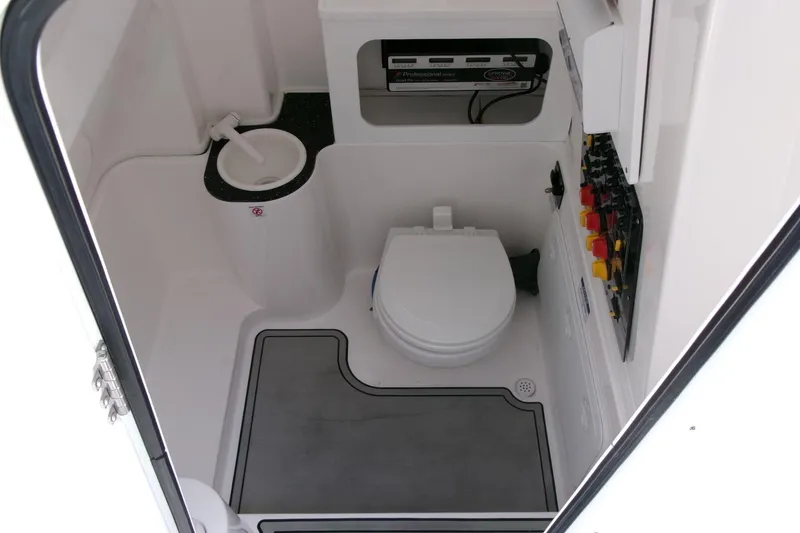 Slide: The Image of 2022 Sea Fox 288 Commander boat interior with toilet and control panel. - 13