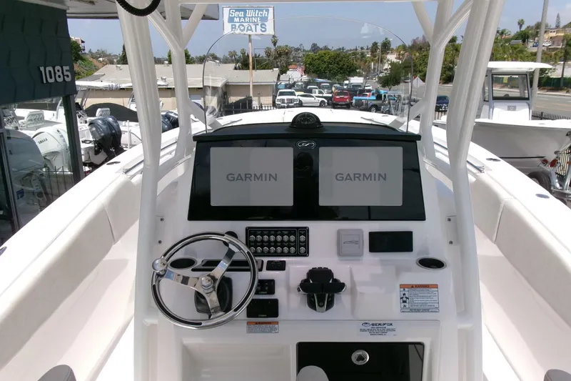Slide: The Image of 2022 Sea Fox 288 Commander boat dashboard with Garmin navigation displays. - 18