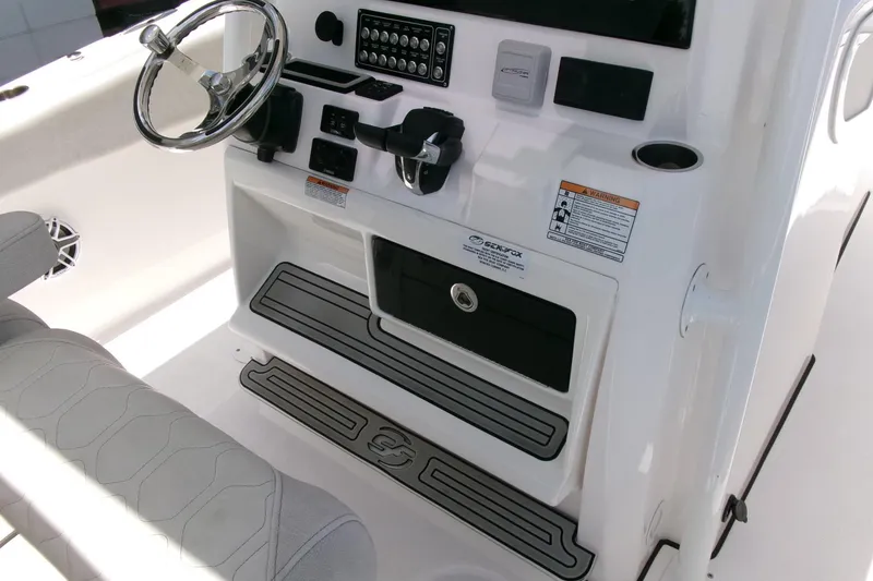 Slide: The Image of 2022 Sea Fox 288 Commander boat console with steering wheel and control panel. - 19