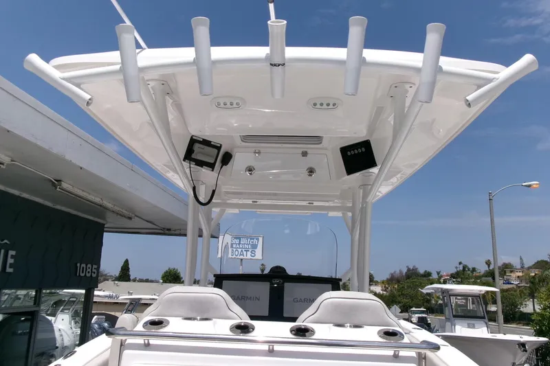 Slide: The Image of 2022 Sea Fox 288 Commander boat with T-top and electronics, docked at a marina. - 21
