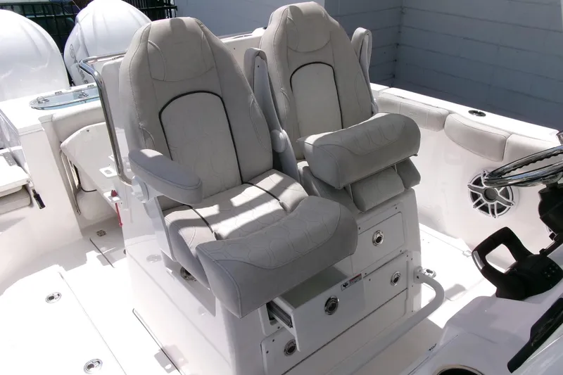 Slide: The Image of 2022 Sea Fox 288 Commander boat interior with dual cushioned captain's chairs. - 22