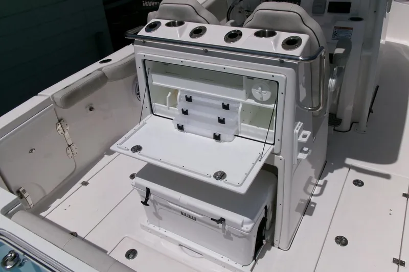 Slide: The Image of 2022 Sea Fox 288 Commander boat interior with open storage compartments and seating. - 25