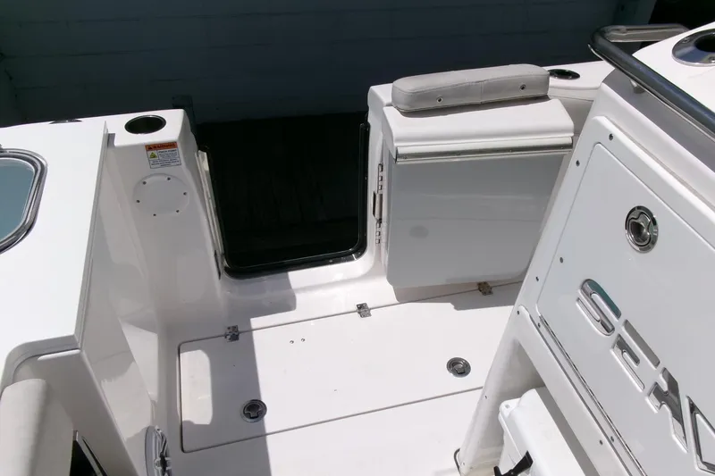Slide: The Image of 2022 Sea Fox 288 Commander boat deck with seating and storage compartments. - 28