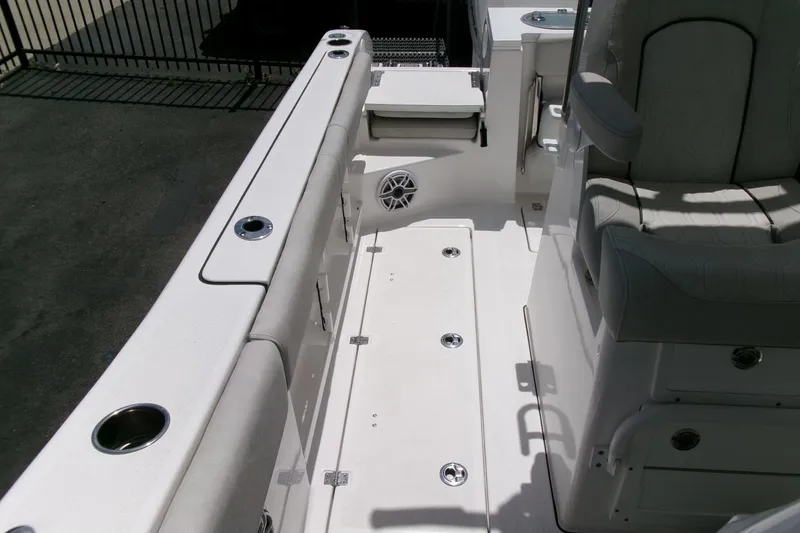 Slide: The Image of Interior view of 2022 Sea Fox 288 Commander boat, featuring seating and cup holders. - 31
