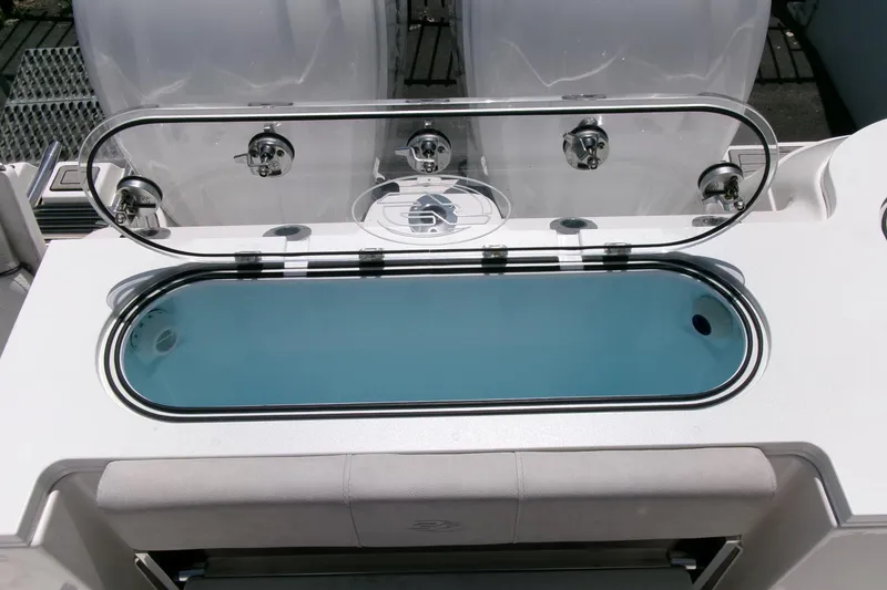 Slide: The Image of 2022 Sea Fox 288 Commander livewell with transparent lid and blue interior. - 36