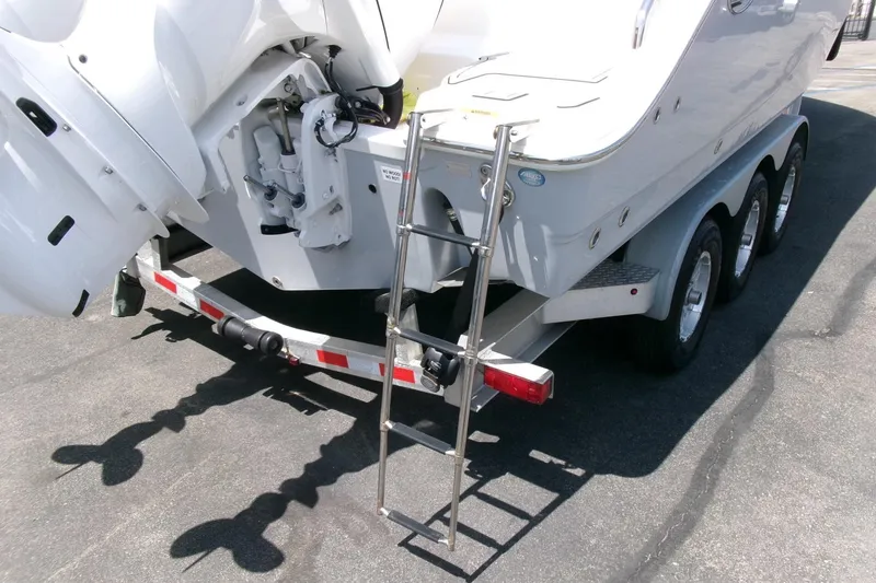 Slide: The Image of 2022 Sea Fox 288 Commander boat on trailer with ladder and triple-axle wheels. - 38