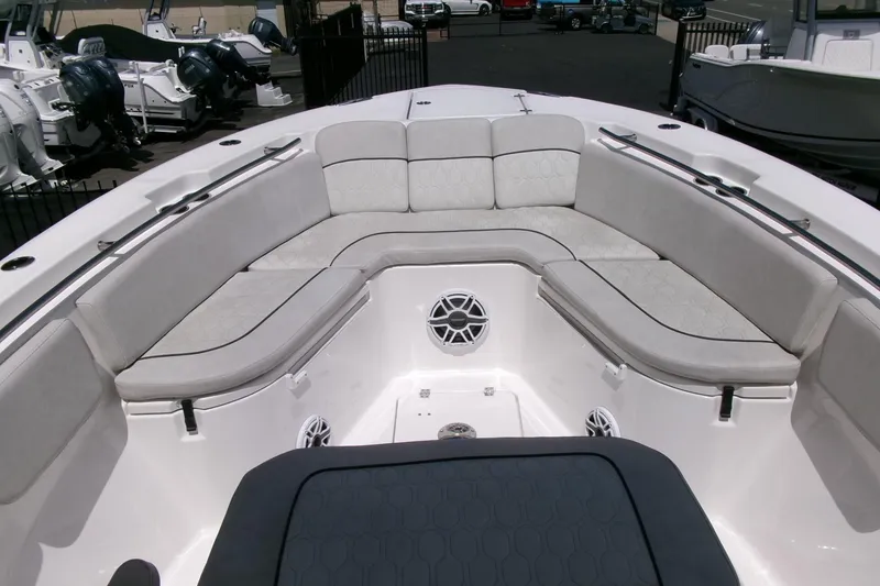 Slide: The Image of 2022 Sea Fox 288 Commander boat interior with cushioned seating and speakers. - 6