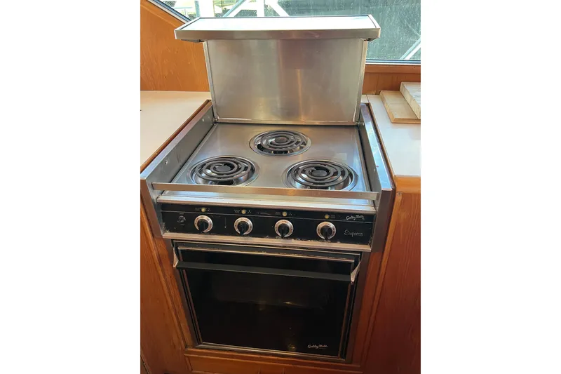 Slide: The Image of Electric stove and oven in 1990 Ocean Alexander 42 yacht kitchen. - 24