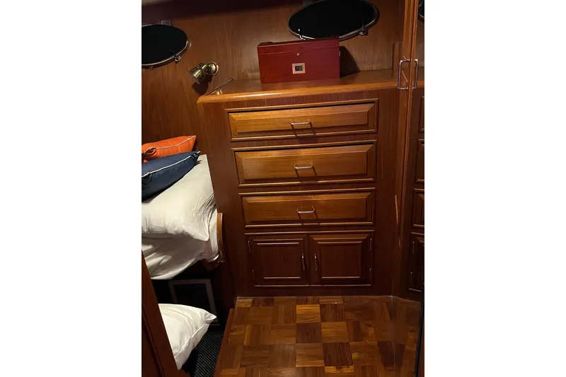 Slide: The Image of Bathroom interior of 1990 Ocean Alexander 42 yacht, featuring sink, mirror, and storage cabinets. - 31