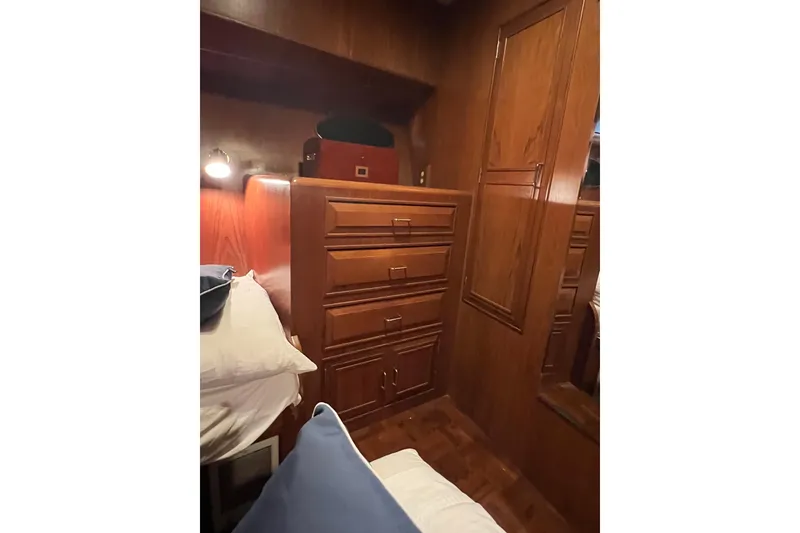 Slide: The Image of Cozy cabin interior of 1990 Ocean Alexander 42 yacht with wooden cabinetry. - 36