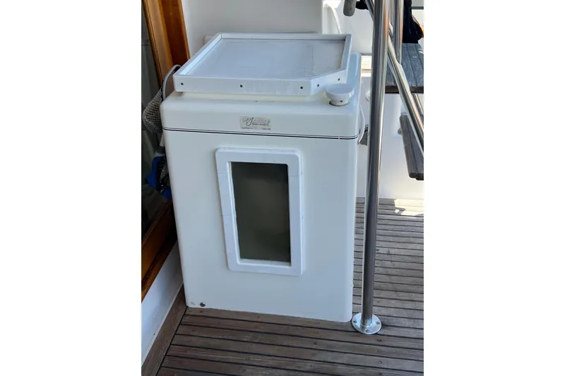 Slide: The Image of Outdoor kitchenette on 1990 Ocean Alexander 42 yacht with sink and storage. - 4
