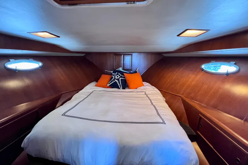 Slide: The Image of Shower area inside 1990 Ocean Alexander 42 yacht, featuring a small window and toiletries. - 40