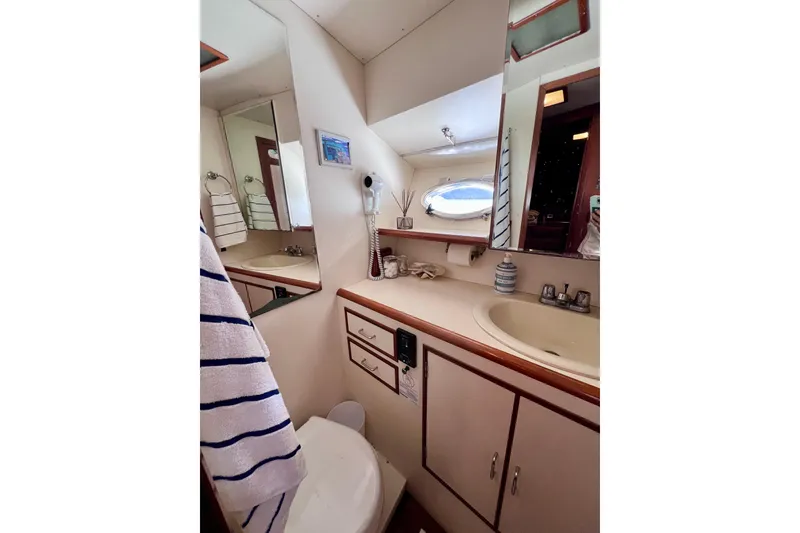 Slide: The Image of Engine room of a 1990 Ocean Alexander 42 yacht, featuring Caterpillar components. - 45