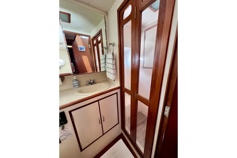 Slide: The Image of Engine room of a 1990 Ocean Alexander 42 yacht, featuring a Caterpillar engine. - 46