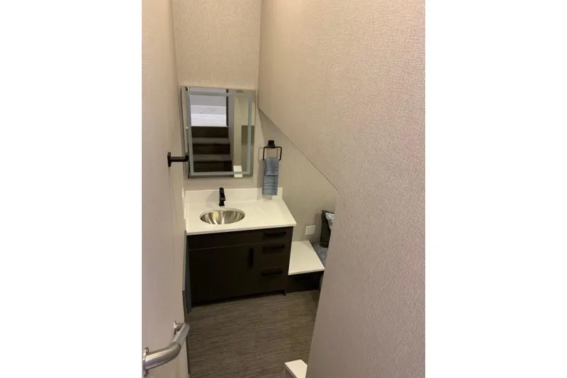 Slide: The Image of Compact bathroom with modern sink, mirror, and towel holder in Adonia Utopia Trip #8, 2019. - 7