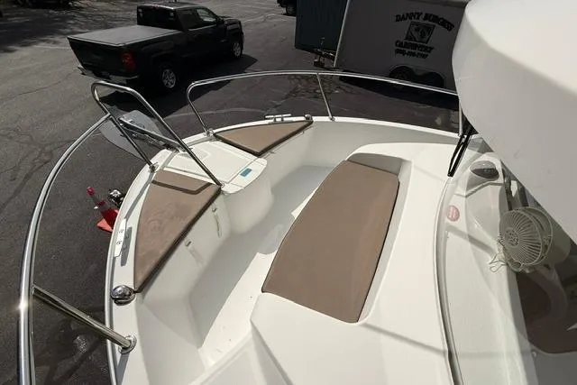 Slide: The Image of 2018 Jeanneau NC Sport 695 boat deck with seating and railing. - 13