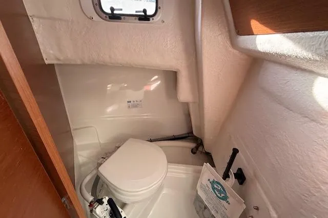 Slide: The Image of Compact marine toilet in 2018 Jeanneau NC Sport 695 boat cabin. - 24