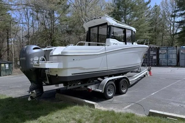 Slide: The Image of 2018 Jeanneau NC Sport 695 boat on trailer, parked outdoors. - 5