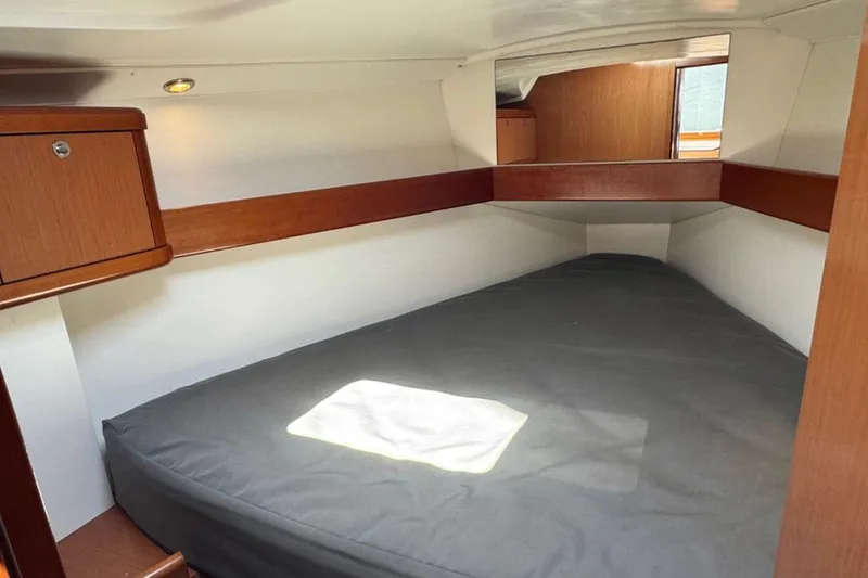 Slide: The Image of Cozy cabin interior of 2010 Beneteau Oceanis 37 sailboat with wooden accents. - 14