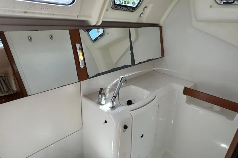 Slide: The Image of Interior of 2010 Beneteau Oceanis 37 yacht bathroom with sink and mirror. - 16