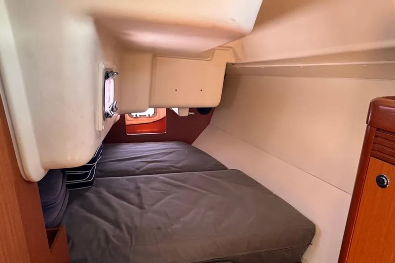 Slide: The Image of Interior cabin of 2010 Beneteau Oceanis 37 sailboat with cozy sleeping area. - 17