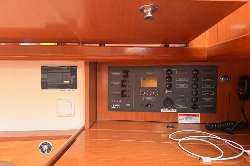 Slide: The Image of Control panel inside a 2010 Beneteau Oceanis 37 yacht, featuring switches and USB charging. - 18