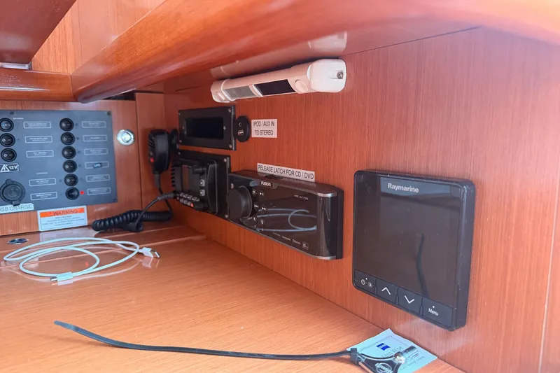 Slide: The Image of Control panel and electronics inside a 2010 Beneteau Oceanis 37 sailboat cabin. - 19