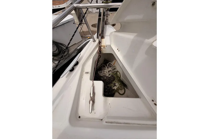 Slide: The Image of Anchor locker of a 2010 Beneteau Oceanis 34 sailboat with ropes and chain. - 28